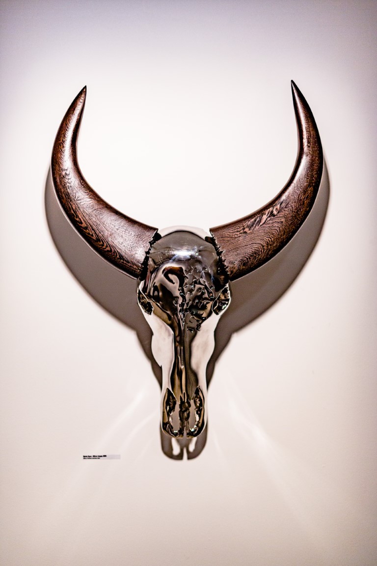 "Mirror image", mirror polished stainless steel + wengé wooden horns, created by Kevin Oyen